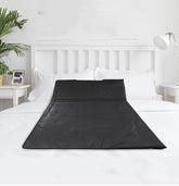 Infrared Sauna Body Blanket on a bed for home spa relaxation.